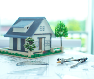 model of a house on top of blueprints